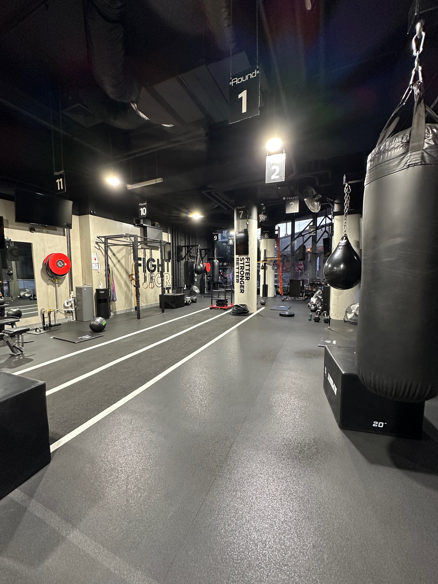 Numbered boxing lanes and heavy bags